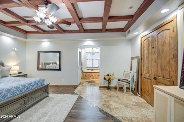 bedroom with beam ceiling, ceiling fan, connected bathroom, light wood-type flooring, and coffered ceiling