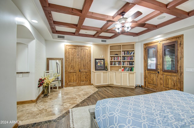 bedroom featuring beamed ceiling, coffered ceiling, ceiling fan, and dark hardwood / wood-style flooring