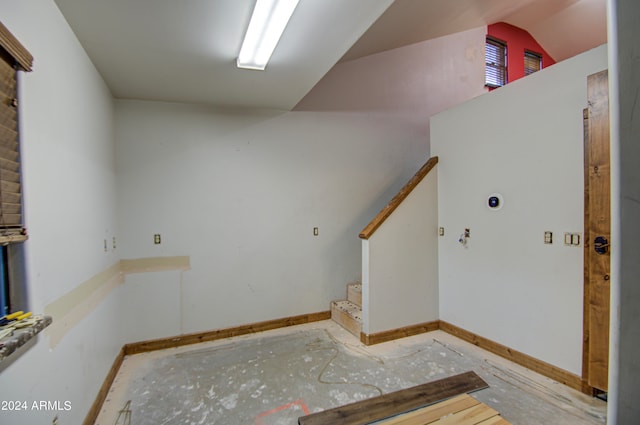 stairway with vaulted ceiling