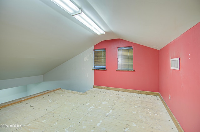 bonus room with vaulted ceiling