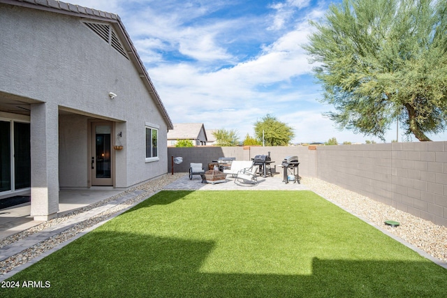 view of yard with a patio area and an outdoor fire pit