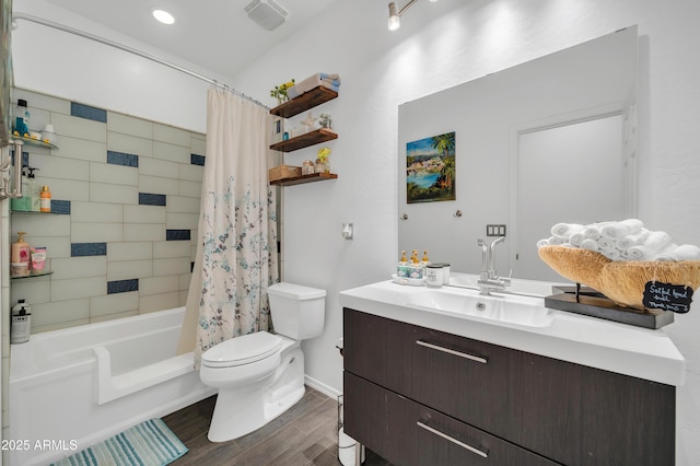 full bathroom with vanity, hardwood / wood-style flooring, toilet, and shower / bath combo with shower curtain