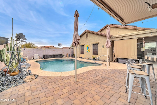 view of swimming pool featuring a patio