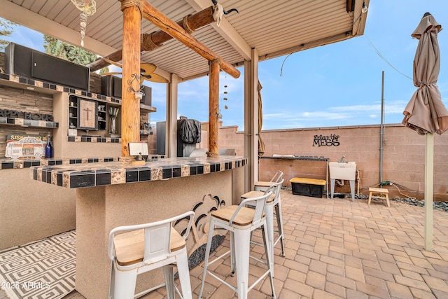 view of patio / terrace with an outdoor bar