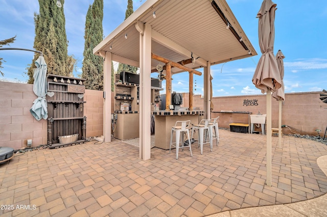 view of patio with exterior bar