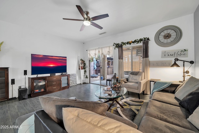 living room with ceiling fan and wood-type flooring