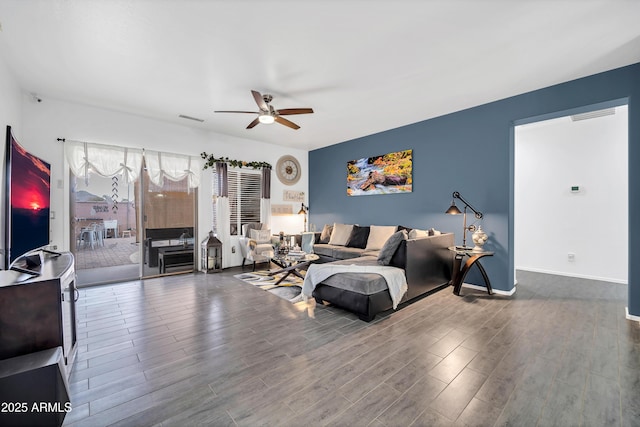 living room with hardwood / wood-style floors and ceiling fan