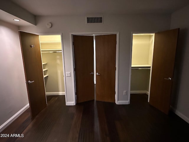 unfurnished bedroom featuring dark hardwood / wood-style flooring