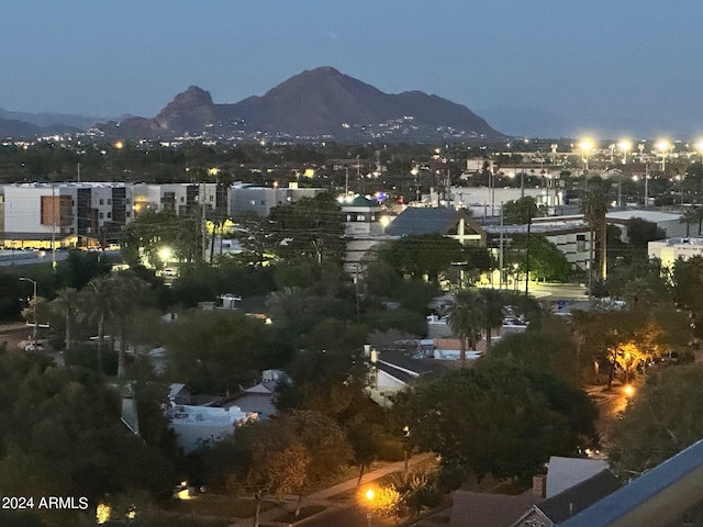 property's view of city featuring a mountain view