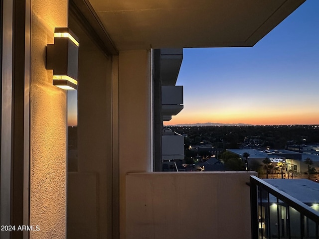 view of balcony at dusk