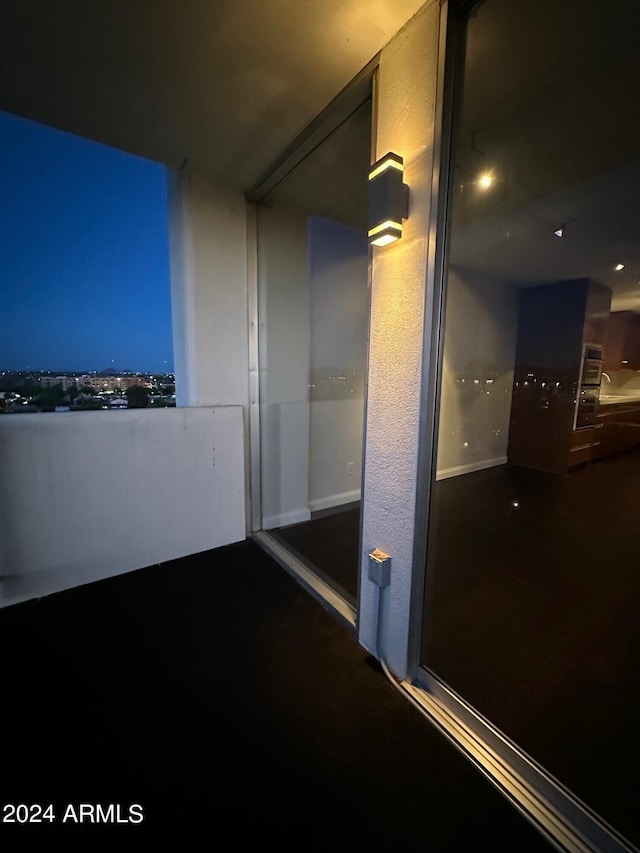 view of balcony at twilight