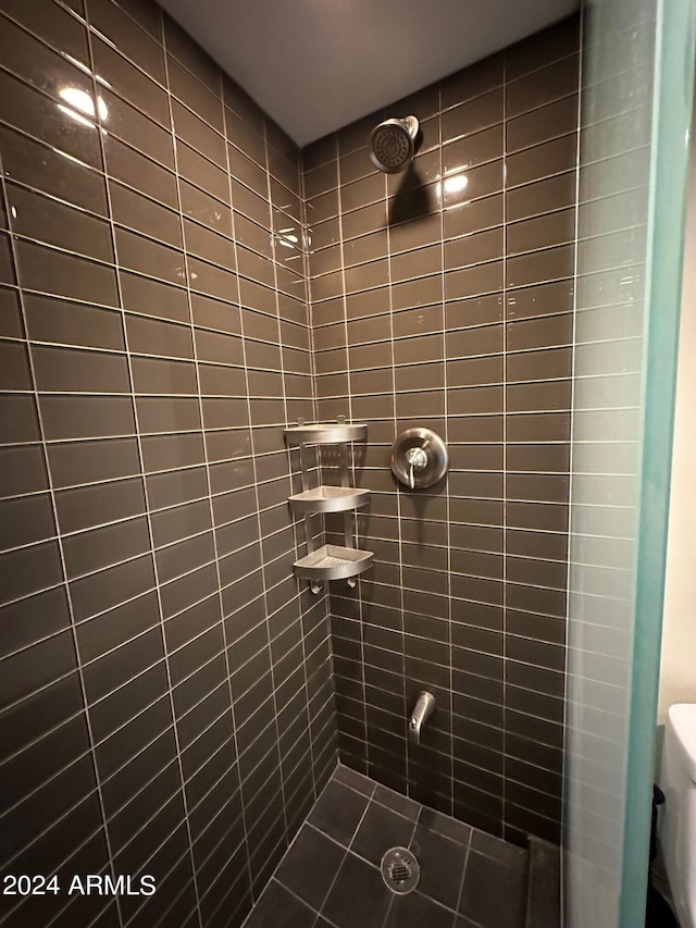 bathroom with a tile shower