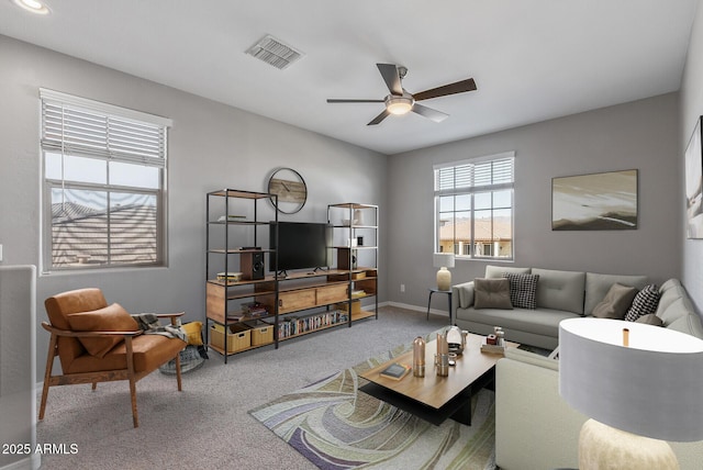 living room featuring ceiling fan and carpet floors