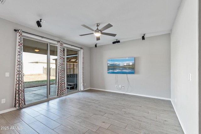 spare room with ceiling fan