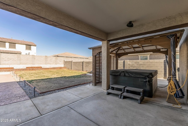 view of patio / terrace featuring a hot tub