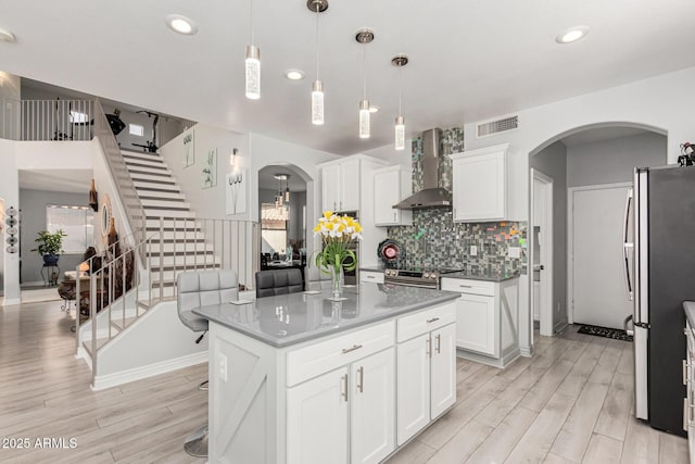 337 E Clairidge Dr, San Tan Valley, AZ 85143 - kitchen with wall chimney range hood, a kitchen island, and pendant lighting