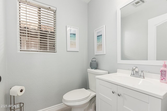 337 E Clairidge Dr, San Tan Valley, AZ 85143 - half bathroom with toilet, visible vents, and vanity