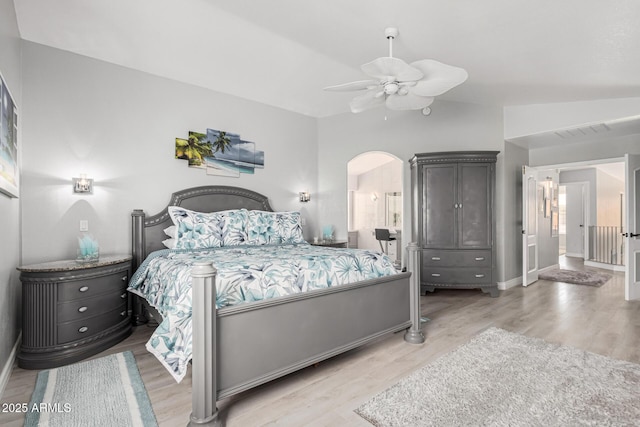 337 E Clairidge Dr, San Tan Valley, AZ 85143 - bedroom with light wood-type flooring, arched walkways, visible vents, and vaulted ceiling
