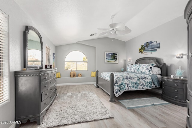 337 E Clairidge Dr, San Tan Valley, AZ 85143 - bedroom with light wood-type flooring, visible vents, lofted ceiling, and baseboards