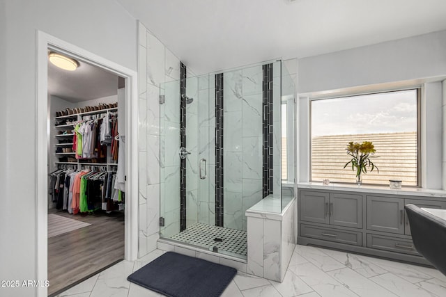 337 E Clairidge Dr, San Tan Valley, AZ 85143 - full bathroom featuring marble finish floor, a marble finish shower, and a walk in closet