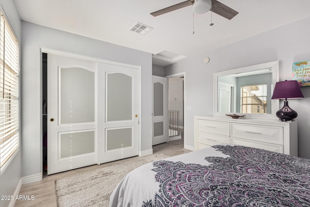 337 E Clairidge Dr, San Tan Valley, AZ 85143 - bedroom featuring baseboards, visible vents, ceiling fan, light wood-style floors, and a closet