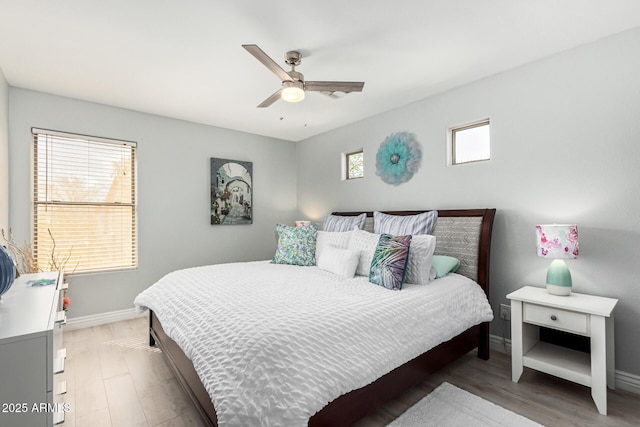 337 E Clairidge Dr, San Tan Valley, AZ 85143 - bedroom featuring ceiling fan, wood finished floors, and baseboards