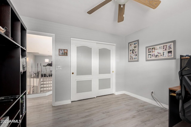 337 E Clairidge Dr, San Tan Valley, AZ 85143 - home office featuring light wood-style floors, baseboards, and a ceiling fan