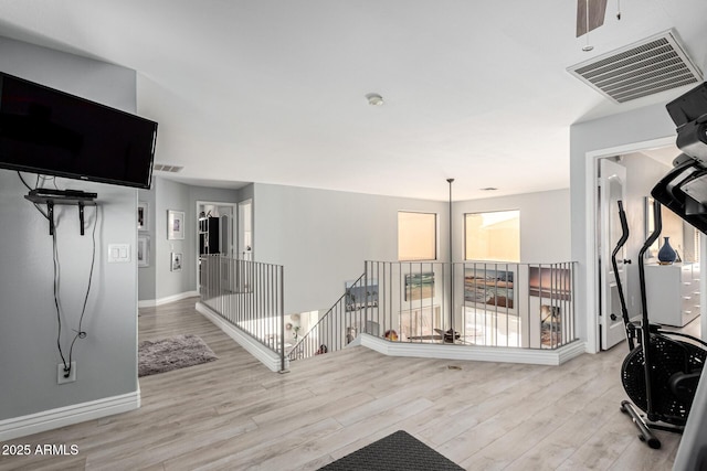 337 E Clairidge Dr, San Tan Valley, AZ 85143 - exercise area with light wood-style floors, baseboards, and visible vents