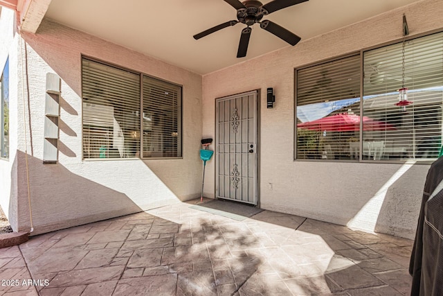 337 E Clairidge Dr, San Tan Valley, AZ 85143 - entrance to property with stucco siding, a ceiling fan, and a patio