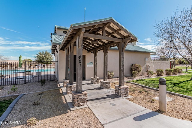 337 E Clairidge Dr, San Tan Valley, AZ 85143 - view of patio with a community pool, fence, and a gazebo