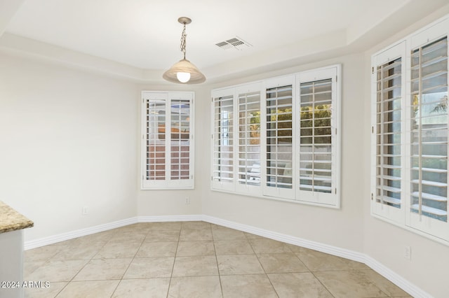 unfurnished dining area with light tile patterned floors