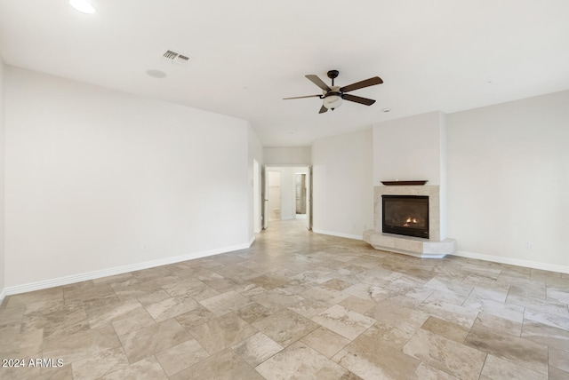 unfurnished living room featuring ceiling fan