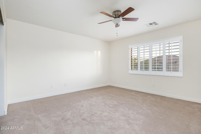 carpeted empty room with ceiling fan