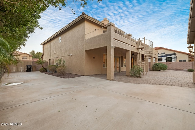 back of property with a patio