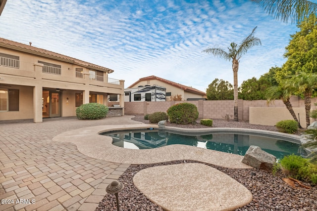 view of swimming pool featuring a patio