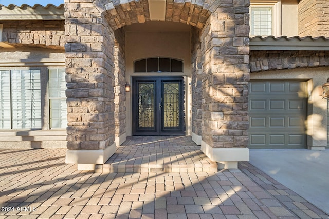 view of exterior entry featuring french doors