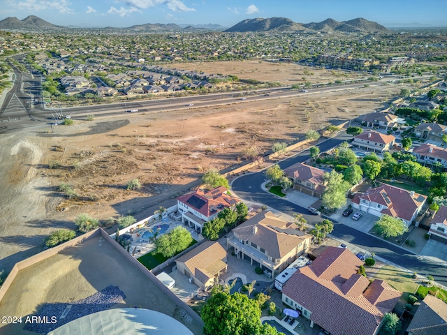 birds eye view of property with a mountain view