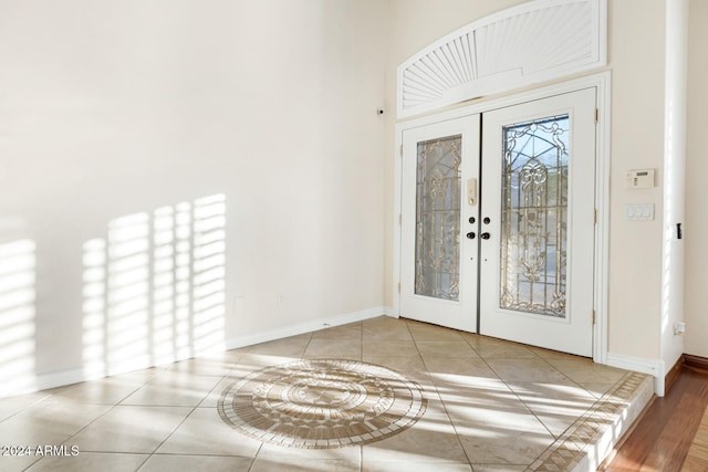 tiled entryway with french doors