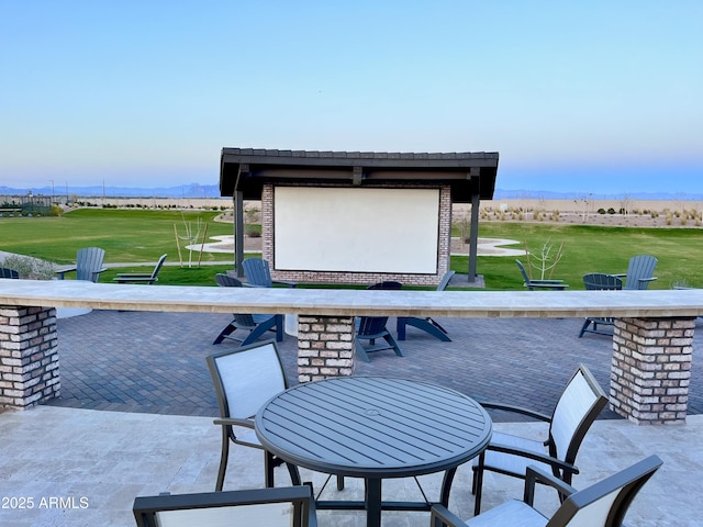 view of patio with a mountain view and outdoor dry bar
