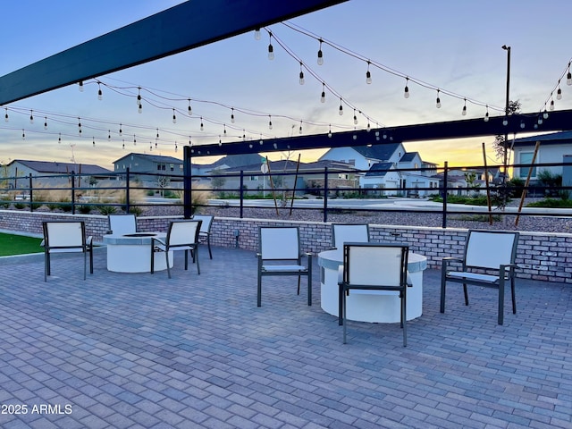 view of patio / terrace with fence and an outdoor fire pit