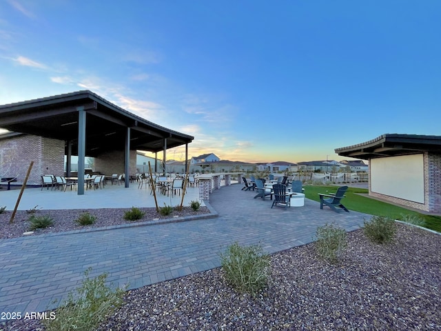 patio terrace at dusk with outdoor dining area