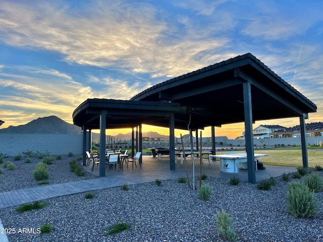 surrounding community with a gazebo and a patio area