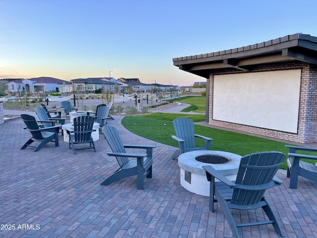 view of patio with a fire pit and a residential view
