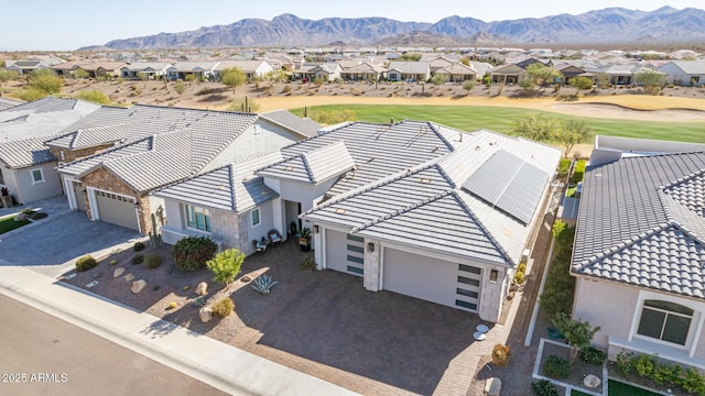 birds eye view of property with a mountain view