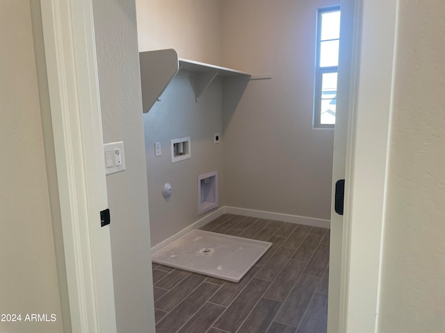 clothes washing area with hookup for an electric dryer, gas dryer hookup, and hookup for a washing machine