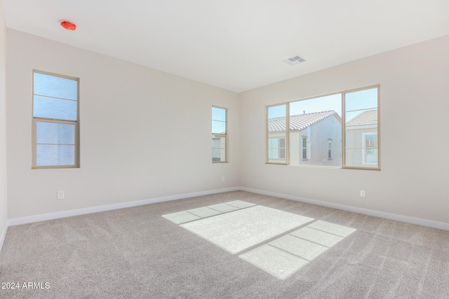 empty room with light colored carpet