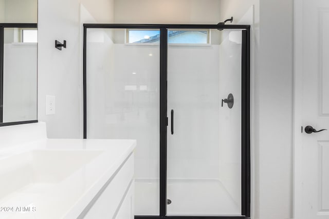 bathroom with vanity and walk in shower