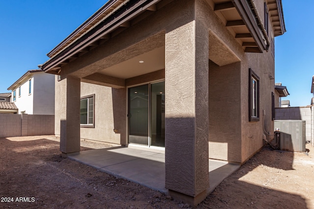 exterior space with cooling unit and a patio area