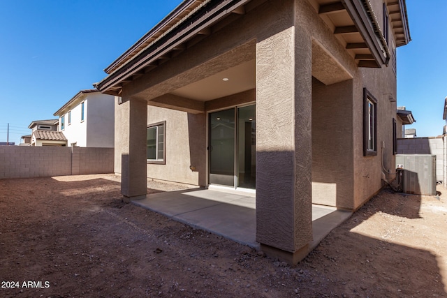 back of house featuring central AC and a patio area