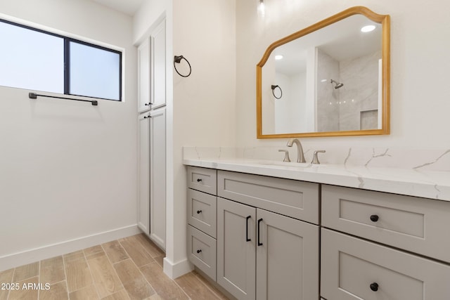 bathroom featuring vanity and a shower